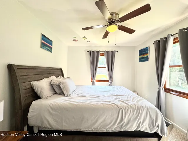 a bedroom with a bed and window