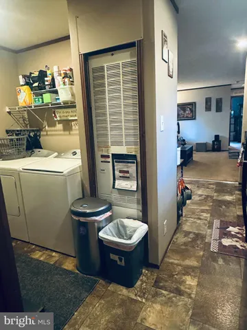 a bedroom with a bed and flat screen tv