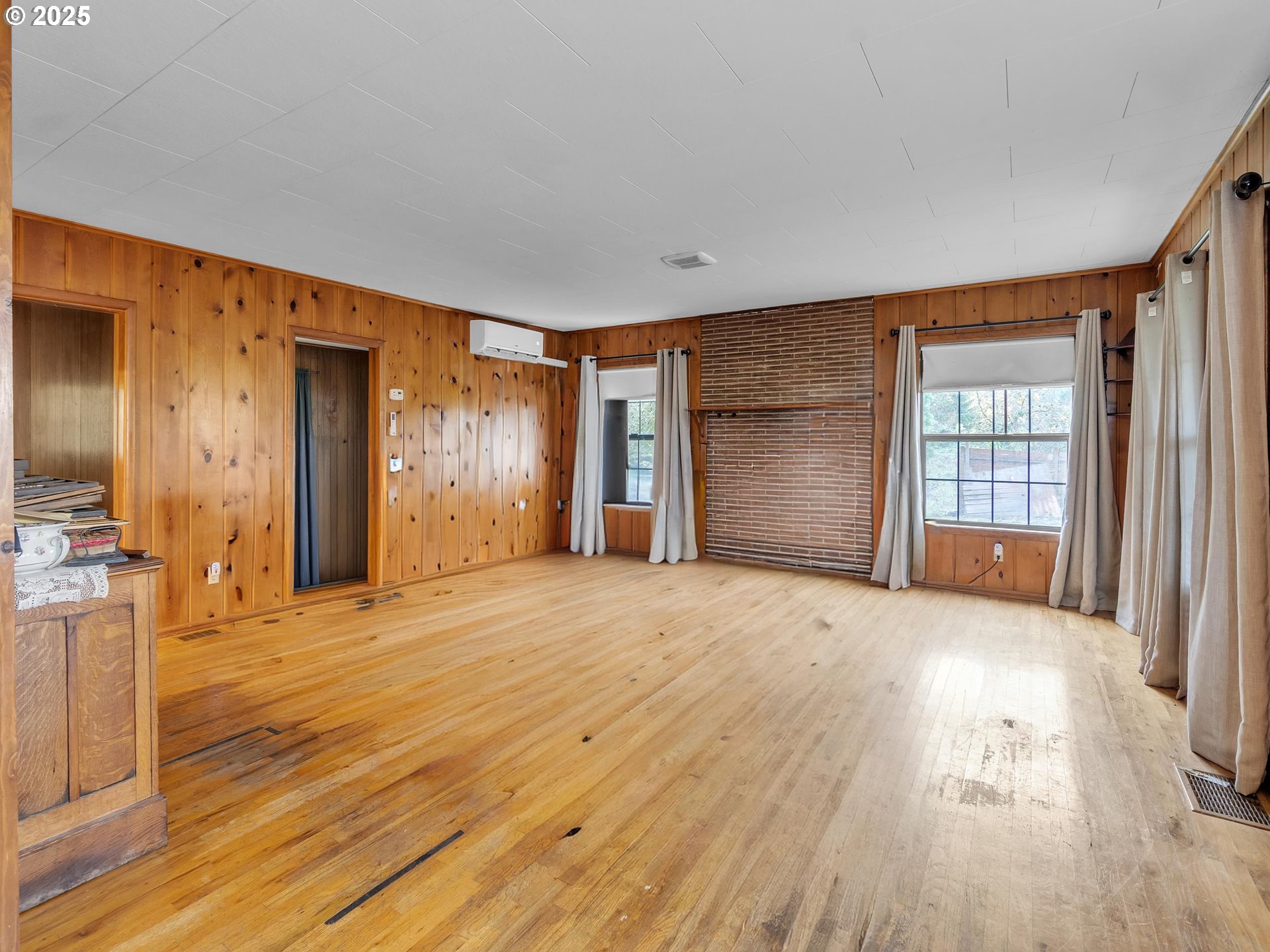 707 Northeast Carty Road Ridgefield, WA 98642 - Photo 4 of 31 a view of empty room with wooden floor and entryway