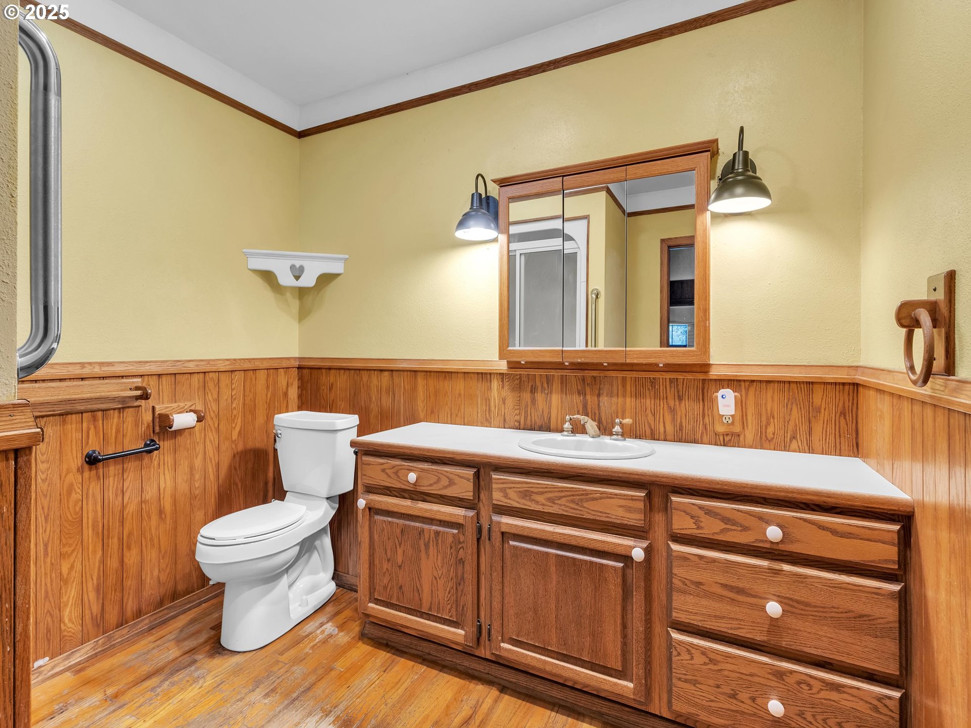 707 Northeast Carty Road Ridgefield, WA 98642 - Photo 7 of 31 a bathroom with a sink a toilet and a mirror