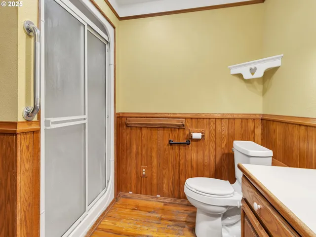 a bathroom with a toilet a sink and a shower