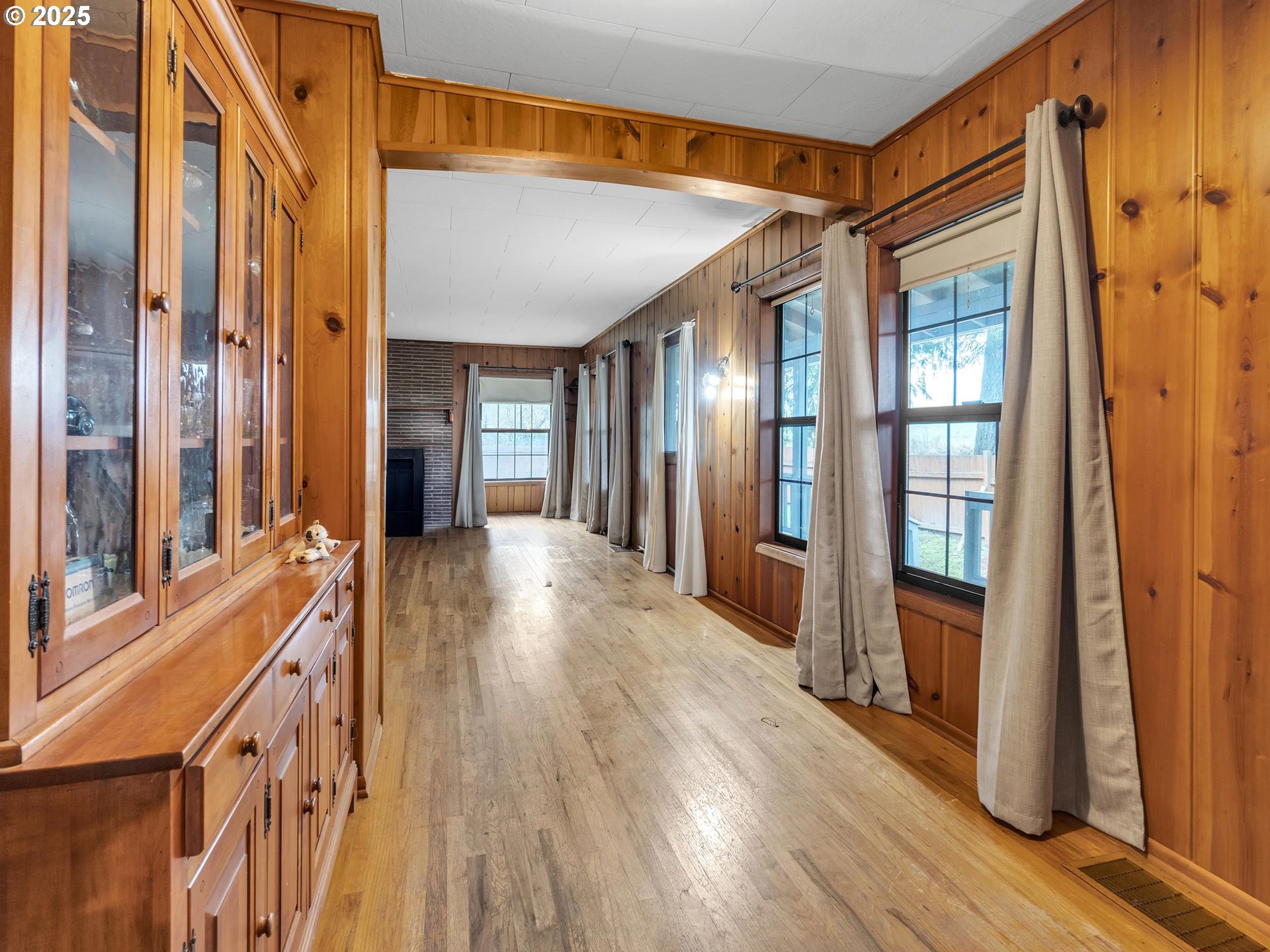 707 Northeast Carty Road Ridgefield, WA 98642 - Photo 9 of 31 a view of an entryway with wooden floor and a livingroom