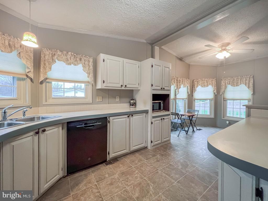 13 Clovedale Way Souderton, PA 18964 - Photo 13 of 33 a kitchen with a sink stove and cabinets