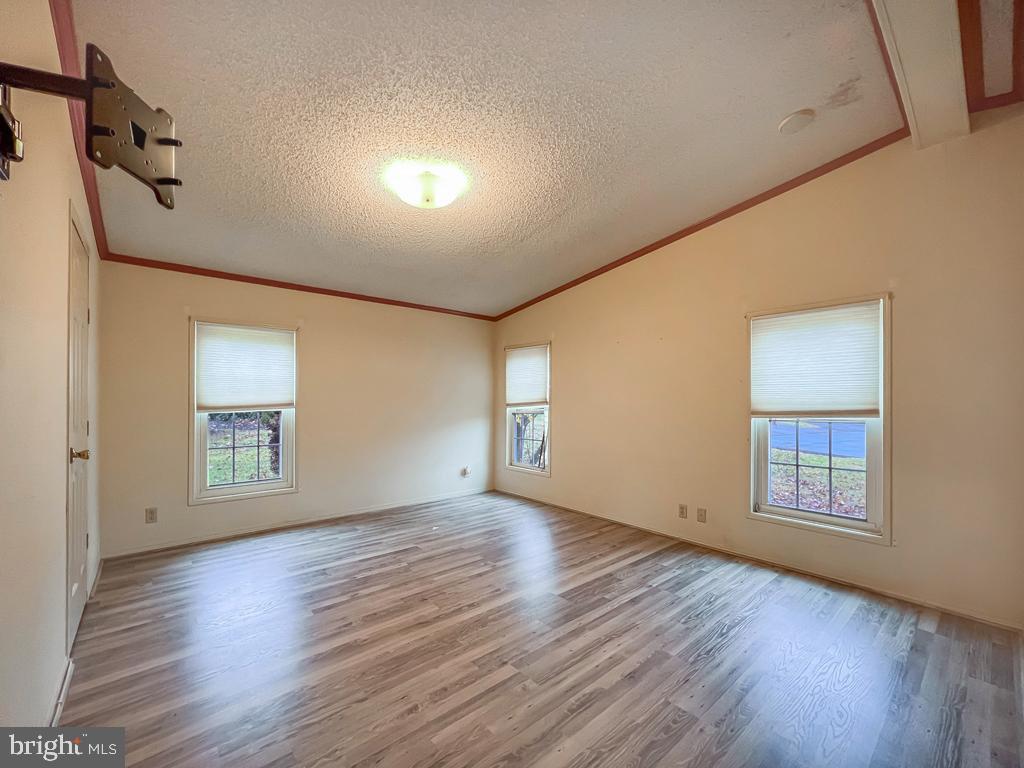 13 Clovedale Way Souderton, PA 18964 - Photo 17 of 33 an empty room with wooden floor and windows