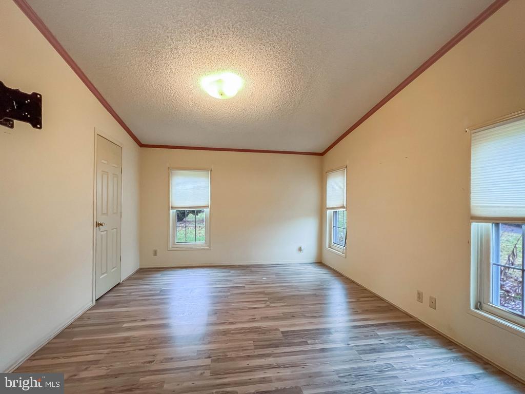 13 Clovedale Way Souderton, PA 18964 - Photo 18 of 33 a view of empty room with wooden floor and fan