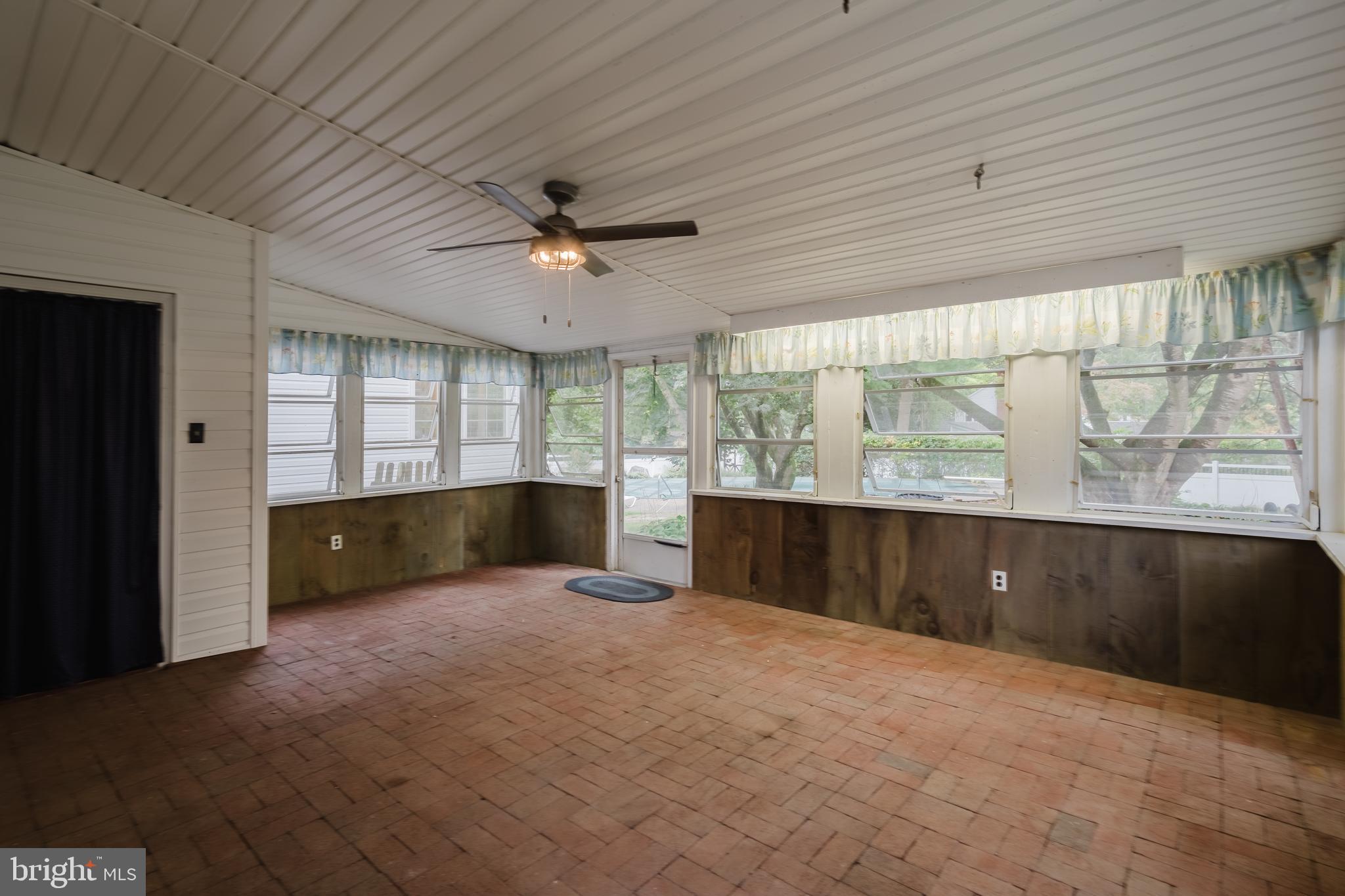 305 Stamford Drive Newark, DE 19711 - Photo 23 of 51 Enclosed porch with brick floors.