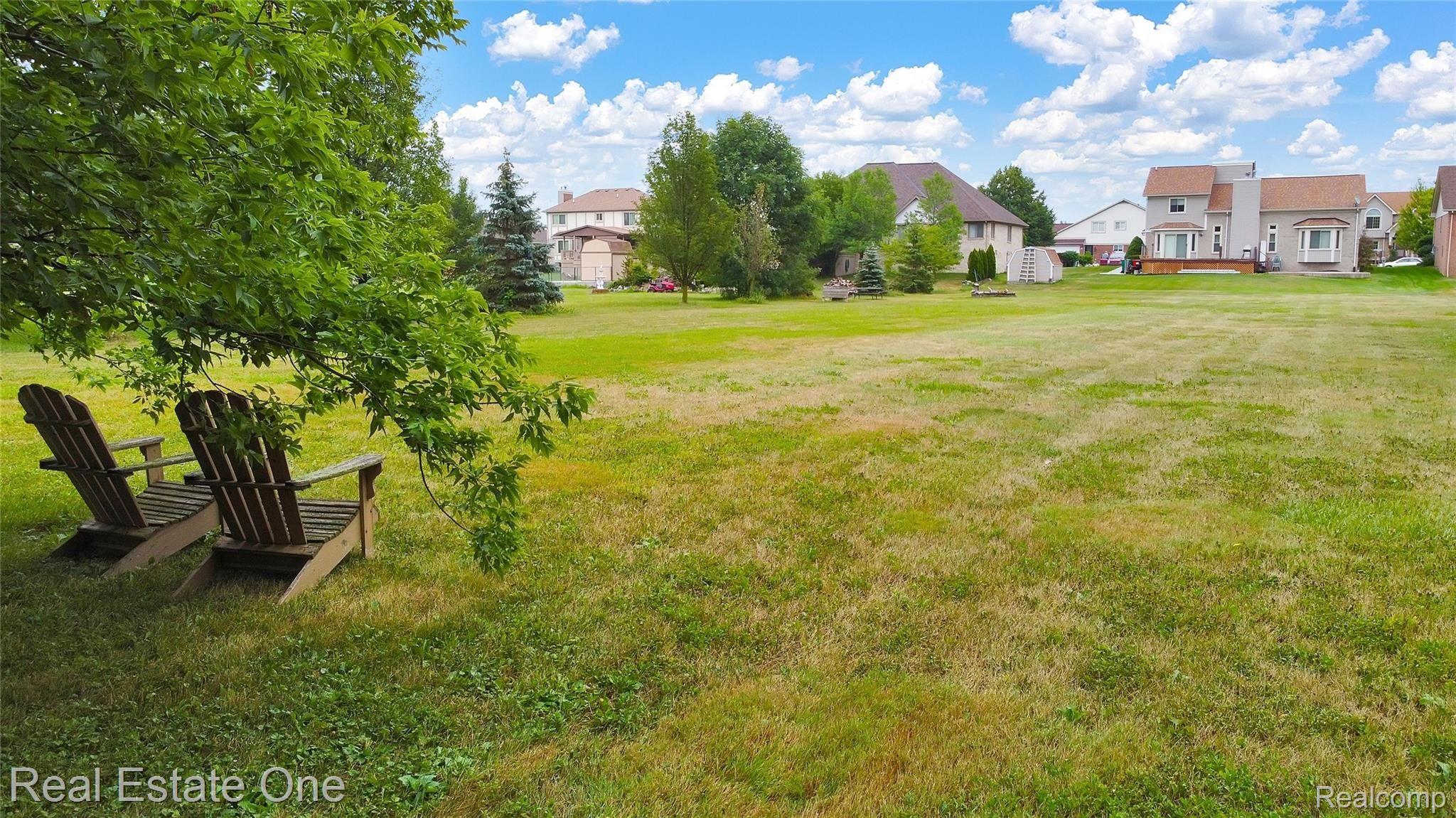 50285 Riverside Drive Macomb, MI 48044 - Photo 35 of 39 SIT BACK IN THE SHADE & ENJOY THE VIEW OF YOUR NEW HOME!!