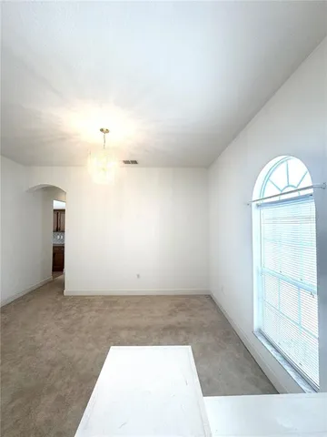 a kitchen with a refrigerator a sink dishwasher stove and oven