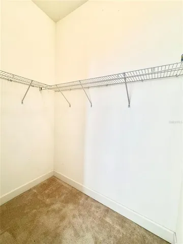 a bathroom with a bathtub and next to a window