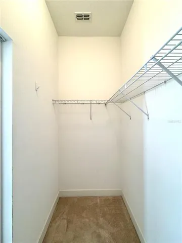 a view of a room with racks on the wall