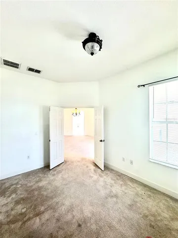 a large white kitchen with a dishwasher a stove top oven a counter space and cabinets