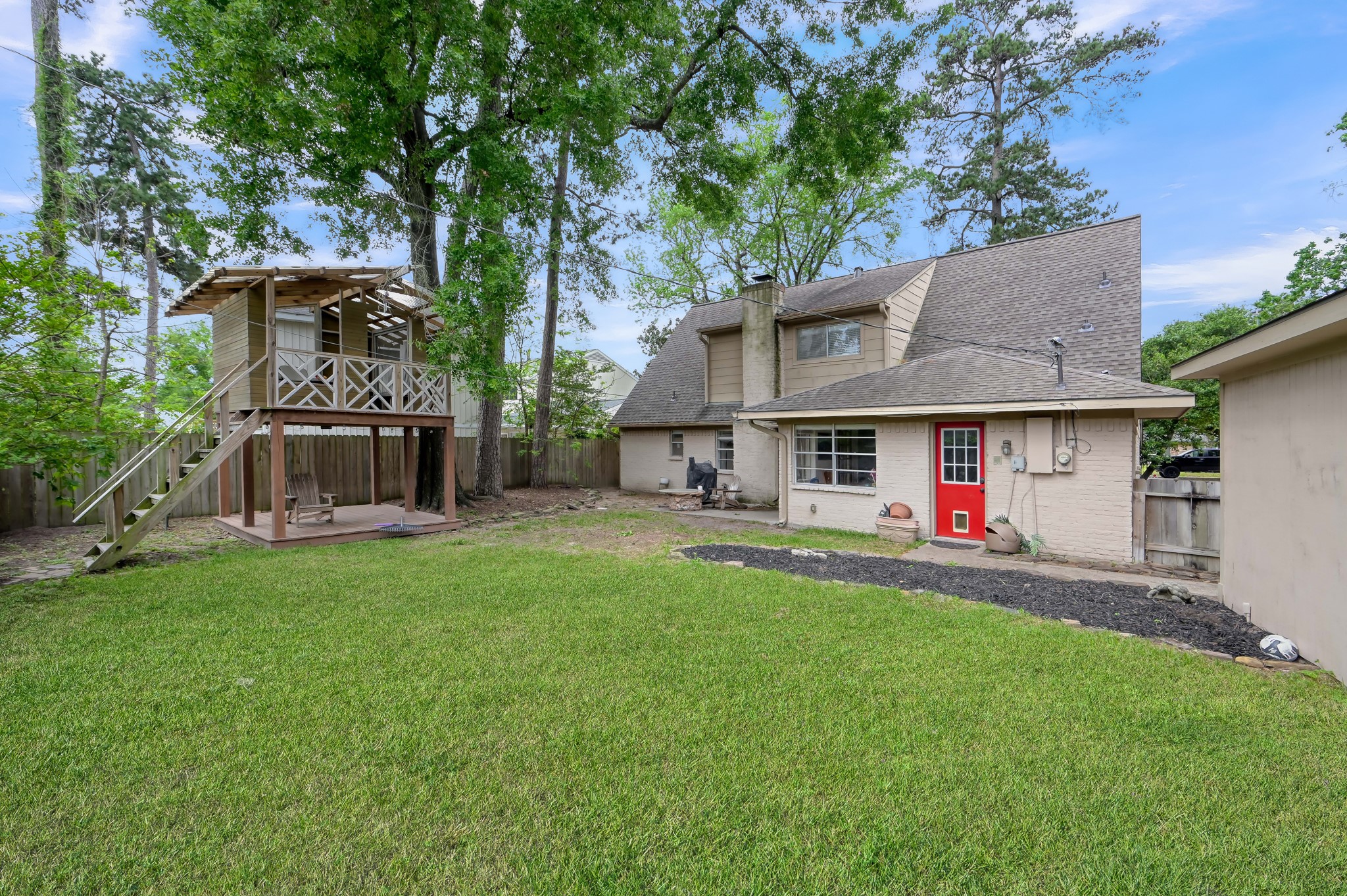 25610 Walnut Grove Circle Spring, TX 77380 - Photo 28 of 29 a view of a house with a back yard