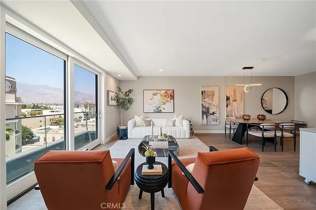a view of a dining room with furniture and window