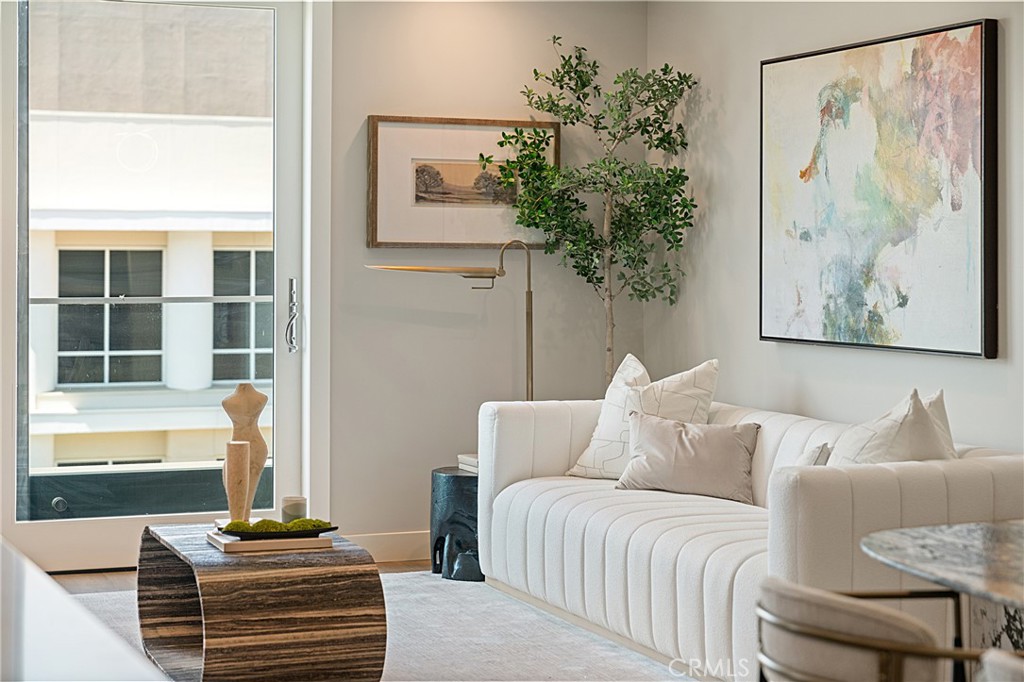 39 South Los Robles Avenue, Unit 6010 Pasadena, CA 91101 - Photo 16 of 38 a living room with furniture and a potted plant