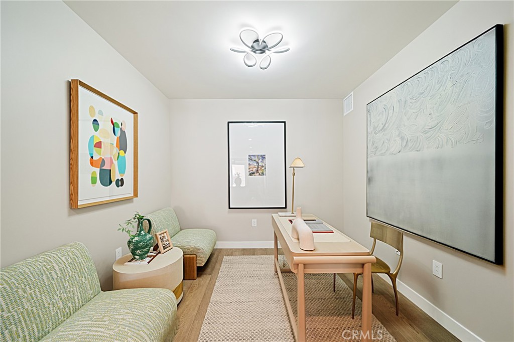 39 South Los Robles Avenue, Unit 6010 Pasadena, CA 91101 - Photo 19 of 38 a living room with furniture and a painting on the wall