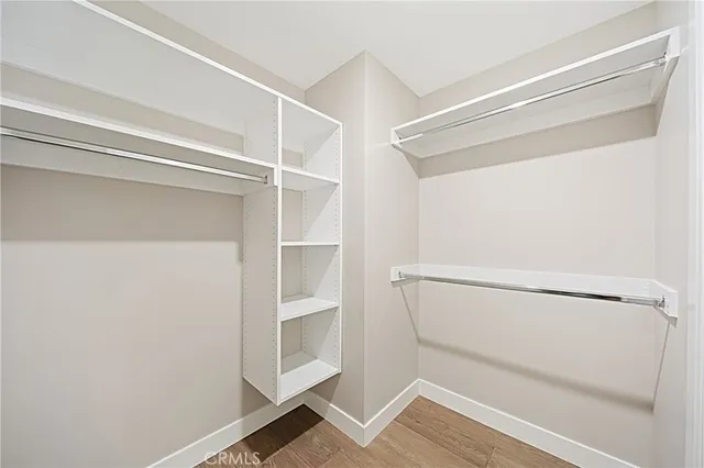 a bathroom with a double vanity sink toilet mirror and bathtub
