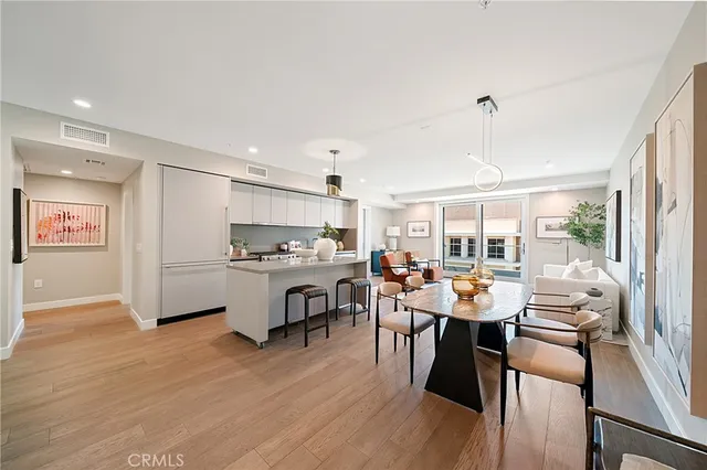 a kitchen with a large counter top appliances and cabinets