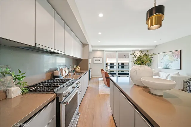 a kitchen that has a table and chairs in it