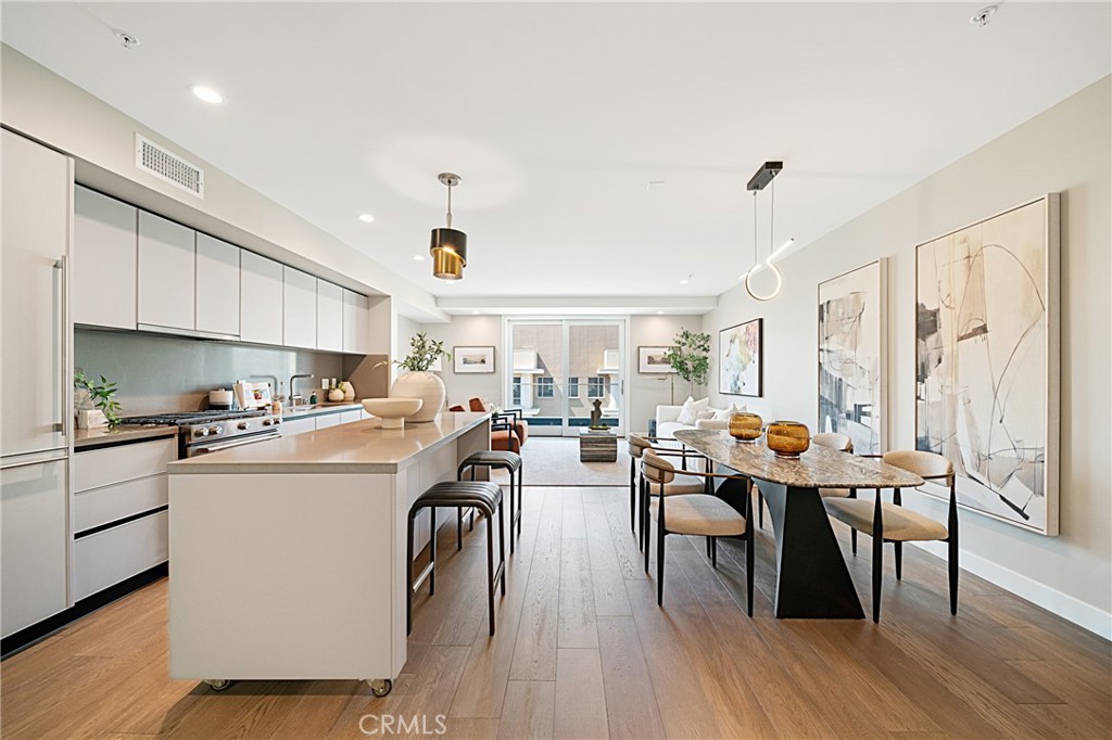 39 South Los Robles Avenue, Unit 6010 Pasadena, CA 91101 - Photo 10 of 38 a kitchen that has a table and chairs in it