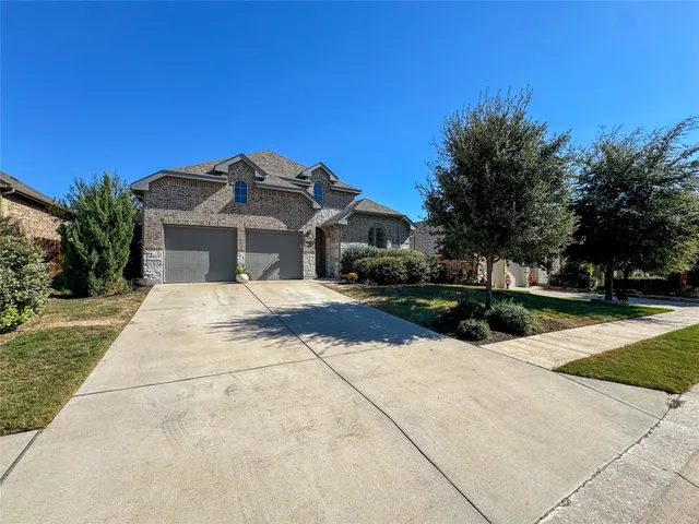 a view of house with yard and green space
