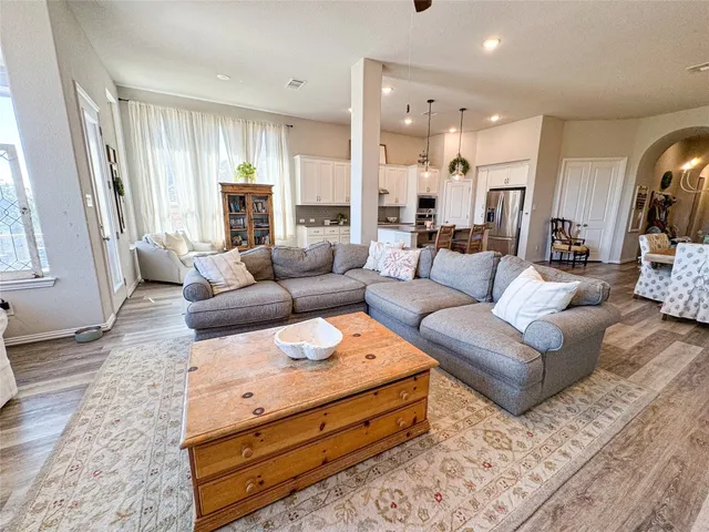 a living room with furniture and a large window