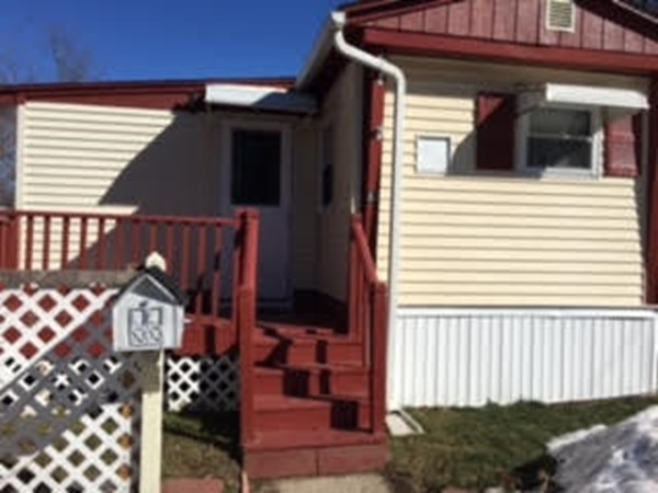 63 Better Way Springfield, MA 01119 - Photo 1 of 12 a view of a house with entryway and wooden fence
