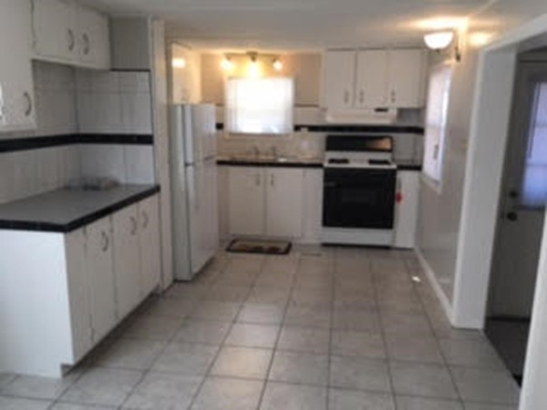 63 Better Way Springfield, MA 01119 - Photo 5 of 12 a kitchen with stainless steel appliances granite countertop a refrigerator and a sink