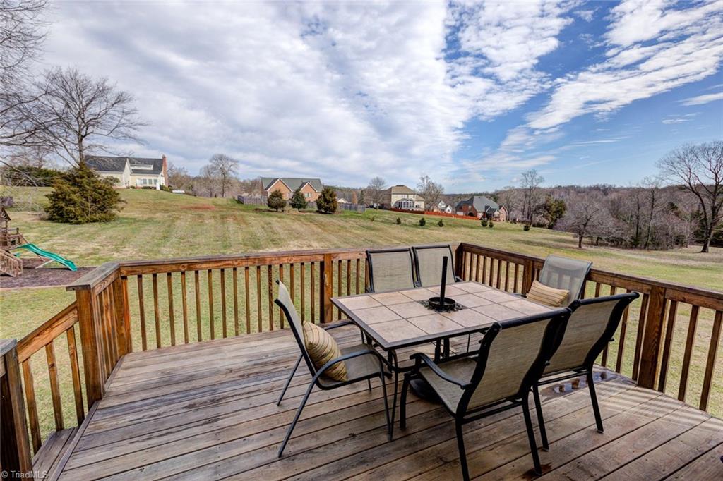 7458 Princess Ann Court Rural Hall, NC 27045 - Photo 14 of 30 Back deck looks out over huge yard with play set.