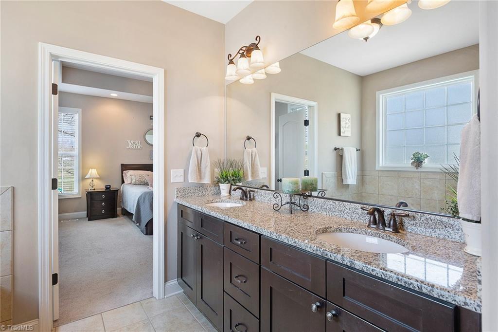 7458 Princess Ann Court Rural Hall, NC 27045 - Photo 17 of 30 Master bath features large granite top vanity.