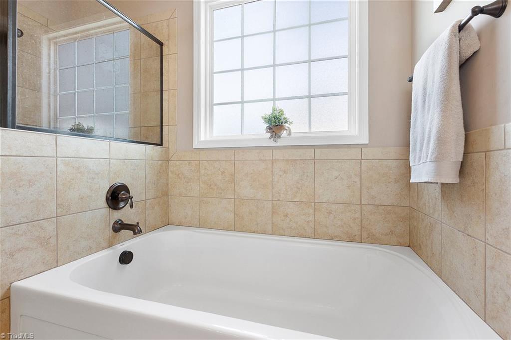7458 Princess Ann Court Rural Hall, NC 27045 - Photo 18 of 30 Garden tub and separate walk-in shower
