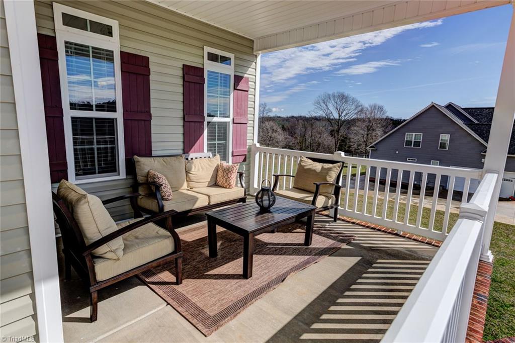 7458 Princess Ann Court Rural Hall, NC 27045 - Photo 3 of 30 Great sized covered front porch overlooking large front yard.