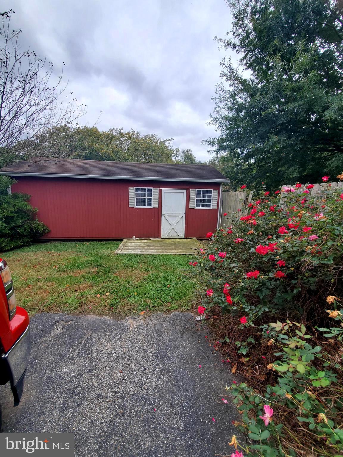 86 Whitetail Lane Magnolia, DE 19962 - Photo 14 of 18 a view of a house with a big yard and potted plants