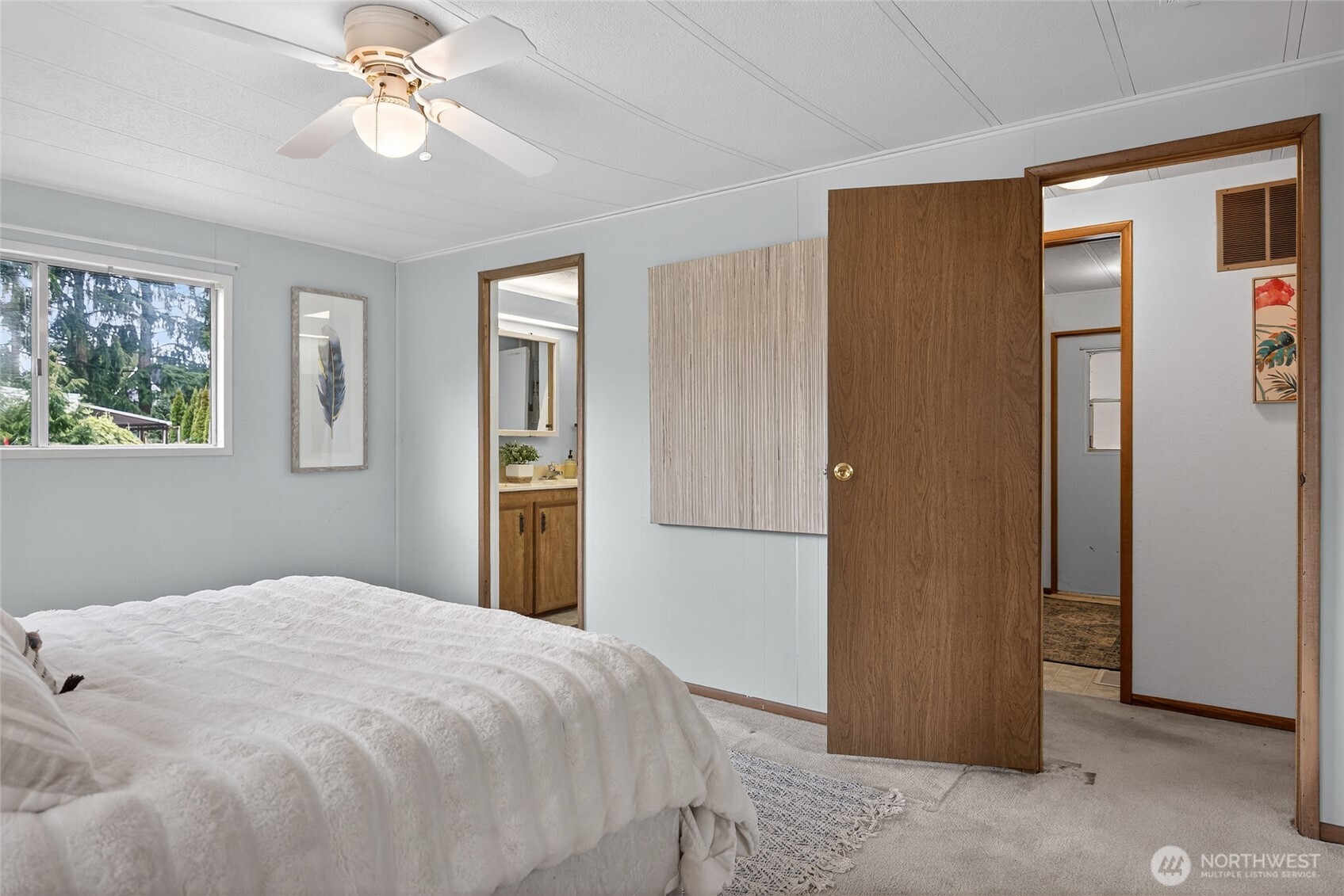 3323 207th Place Southeast Bothell, WA 98012 - Photo 13 of 33 a bedroom with a bed and a chandelier