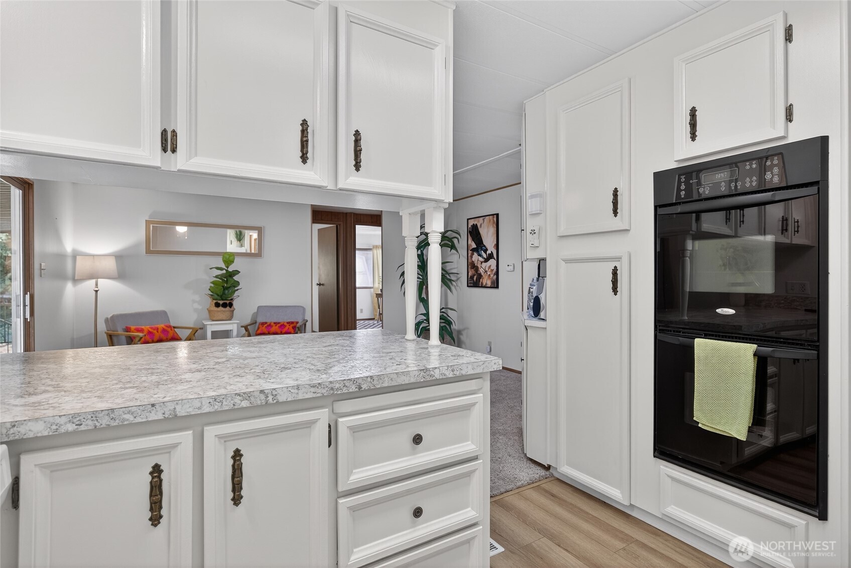 3323 207th Place Southeast Bothell, WA 98012 - Photo 19 of 33 a bathroom with granite countertop a sink and a mirror