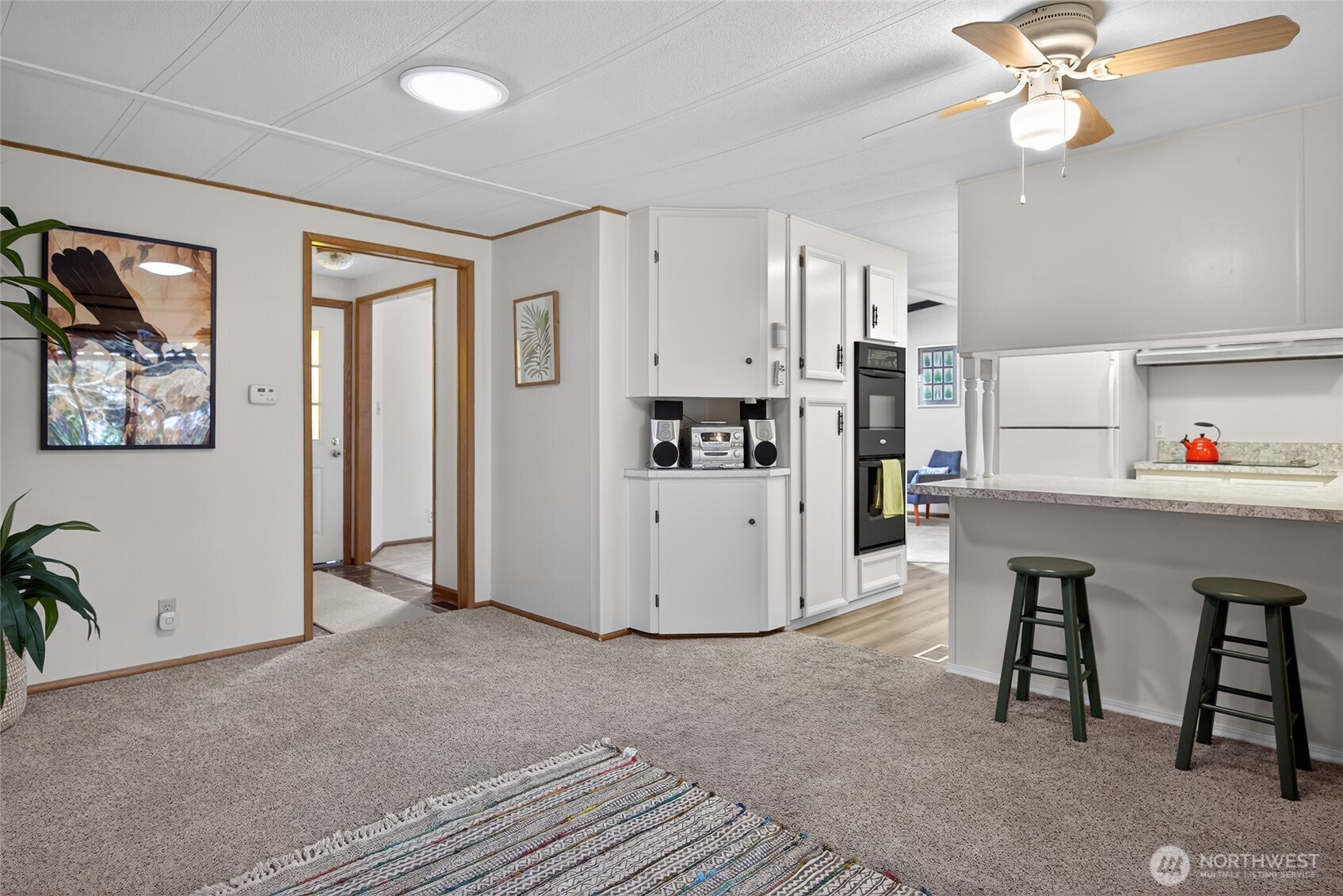 3323 207th Place Southeast Bothell, WA 98012 - Photo 21 of 33 a living room with furniture and a table