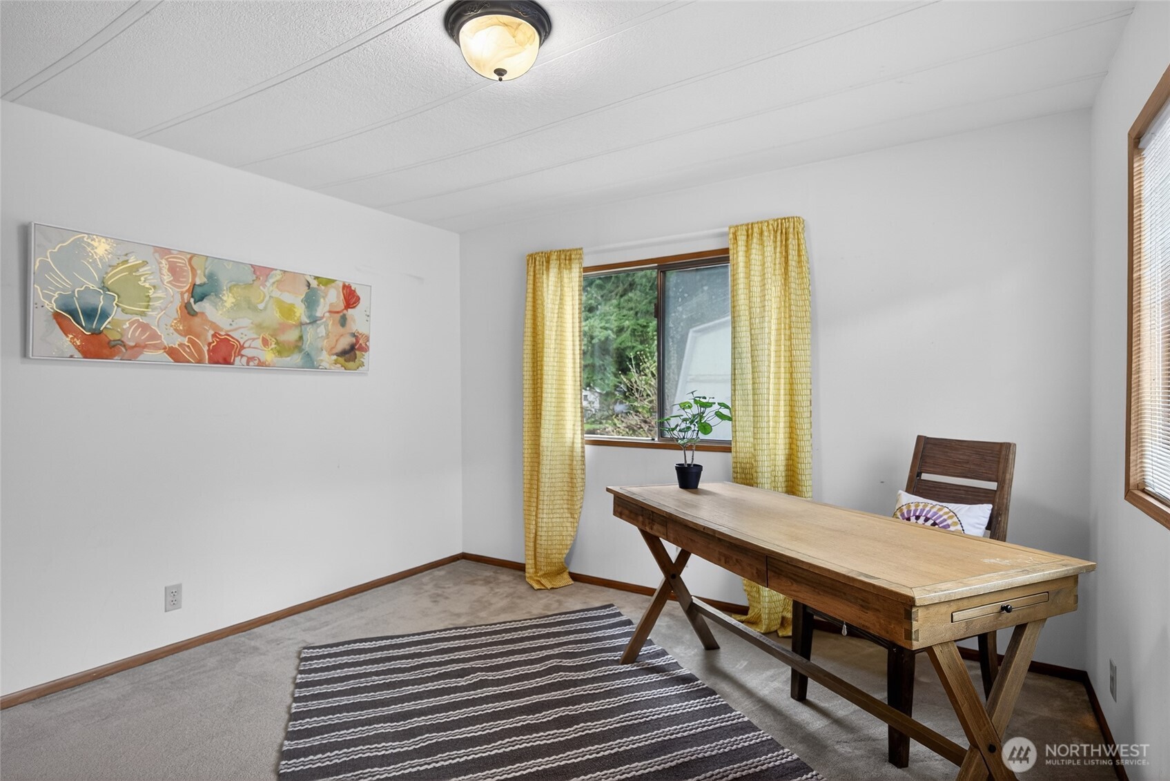 3323 207th Place Southeast Bothell, WA 98012 - Photo 23 of 33 a view of a livingroom with furniture and window