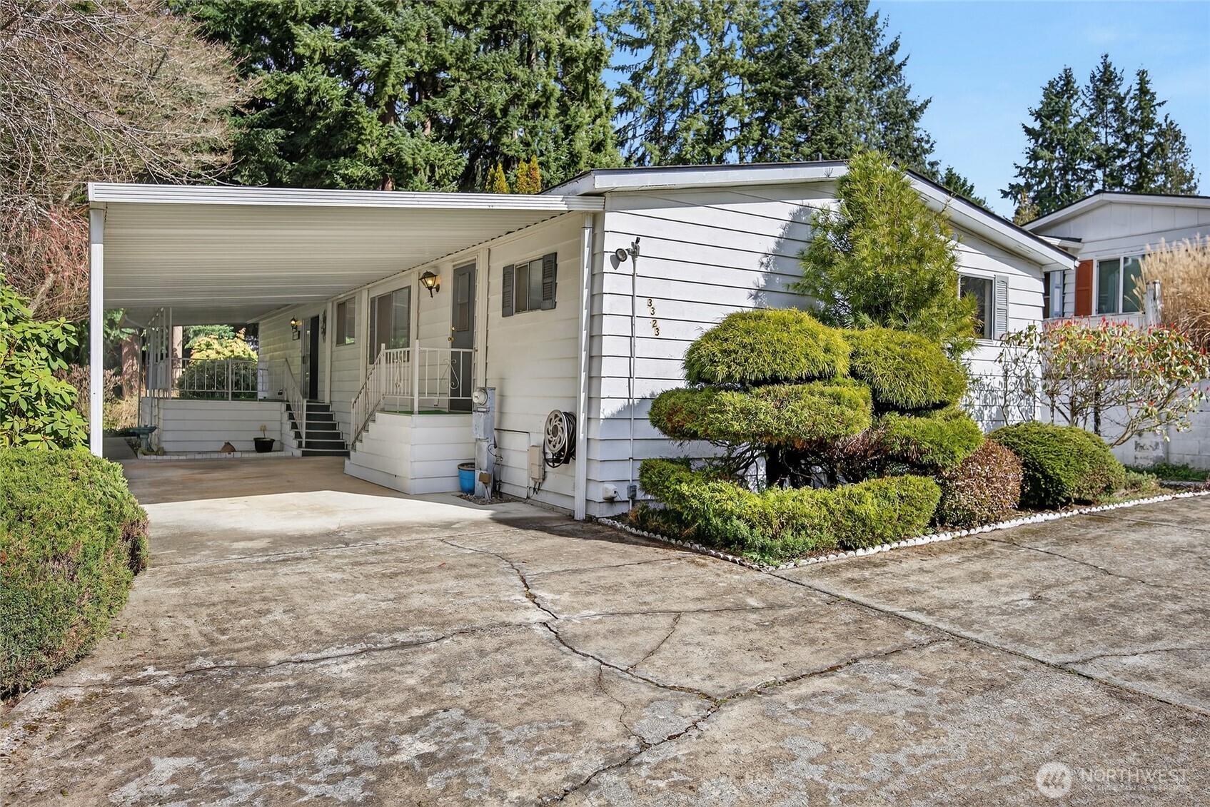 3323 207th Place Southeast Bothell, WA 98012 - Photo 30 of 33 a front view of a house with a yard and potted plants