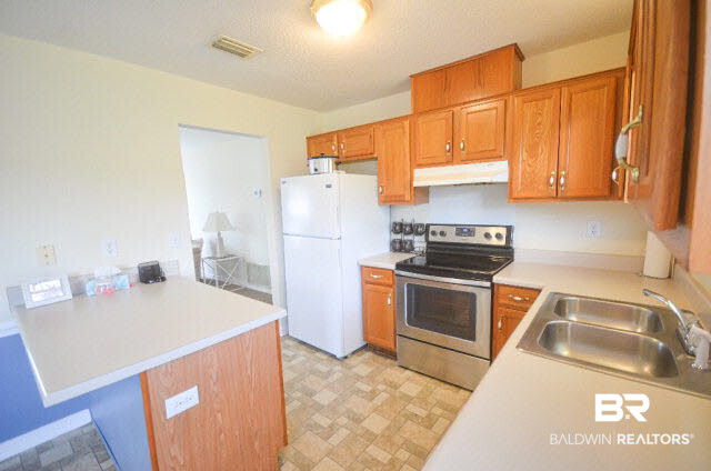 16183 Setter Circle Foley, AL 36535 - Photo 14 of 22 Large kitchen, all appliances to remain including refrigerator.