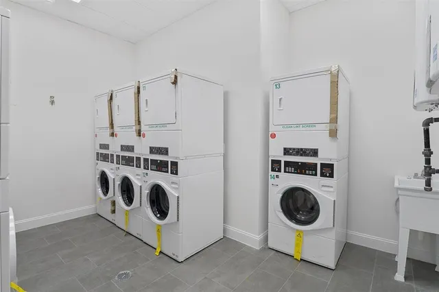 a view of kitchen and utility room with washer and dryer