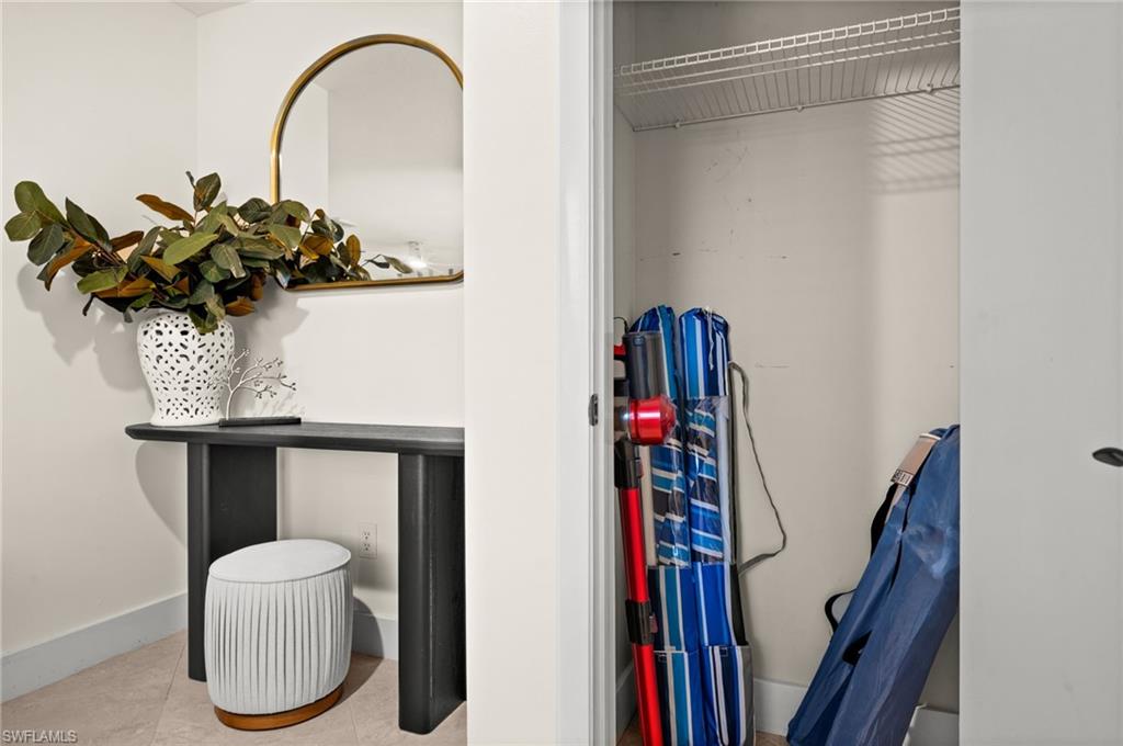 472 Palm River Boulevard Naples, FL 34110 - Photo 48 of 50 a vase of flowers sitting on a table