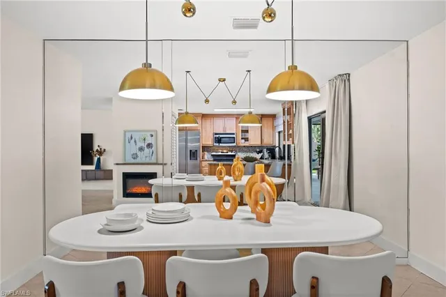 a dining room with furniture a window and kitchen view