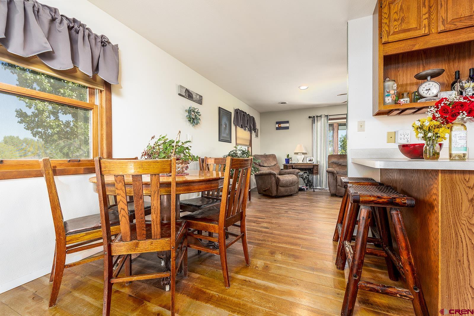9467 6097 Road Montrose, CO 81401 - Photo 11 of 34 a view of a dining room with furniture window and outside view