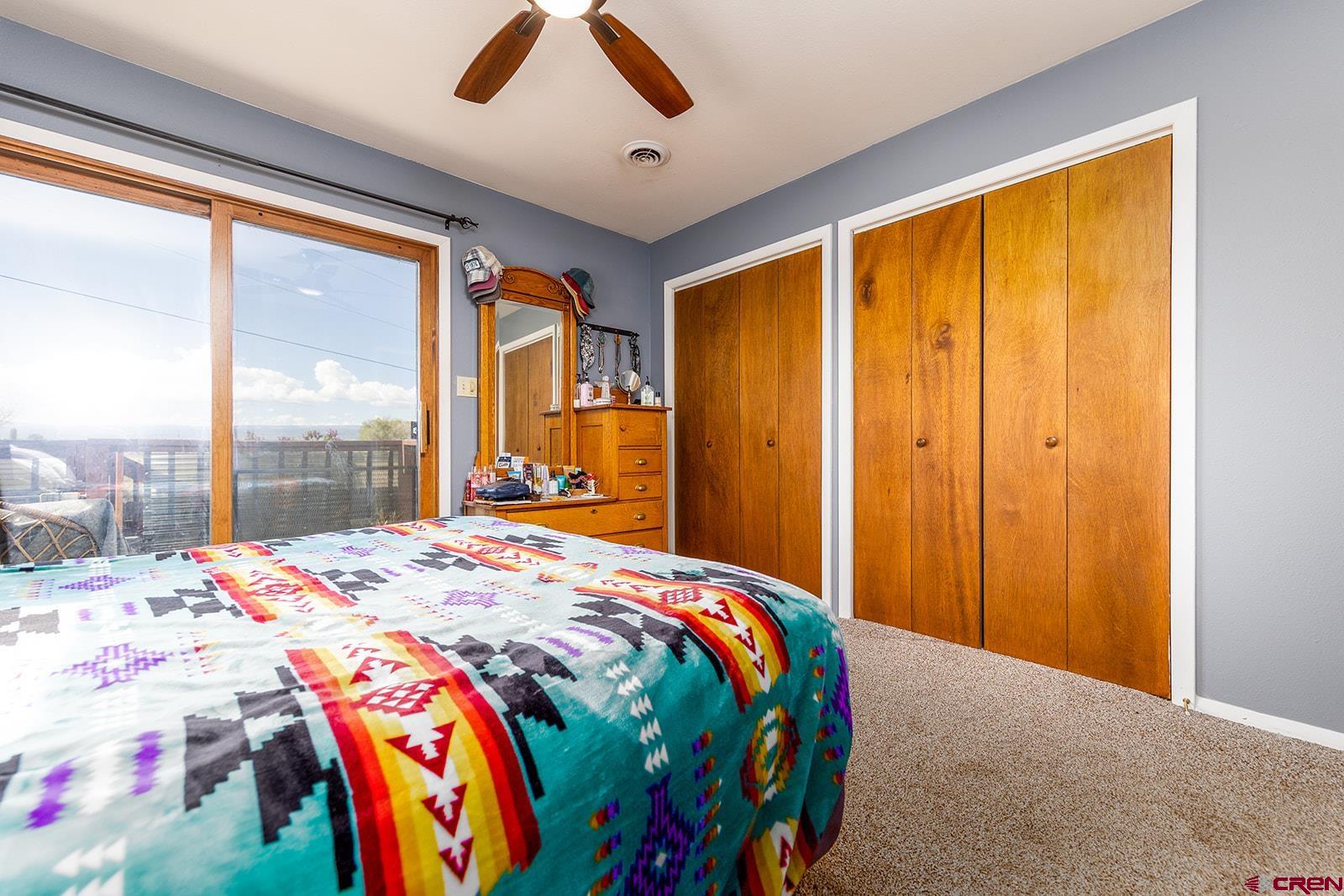 9467 6097 Road Montrose, CO 81401 - Photo 17 of 34 a bedroom with a bed and a window