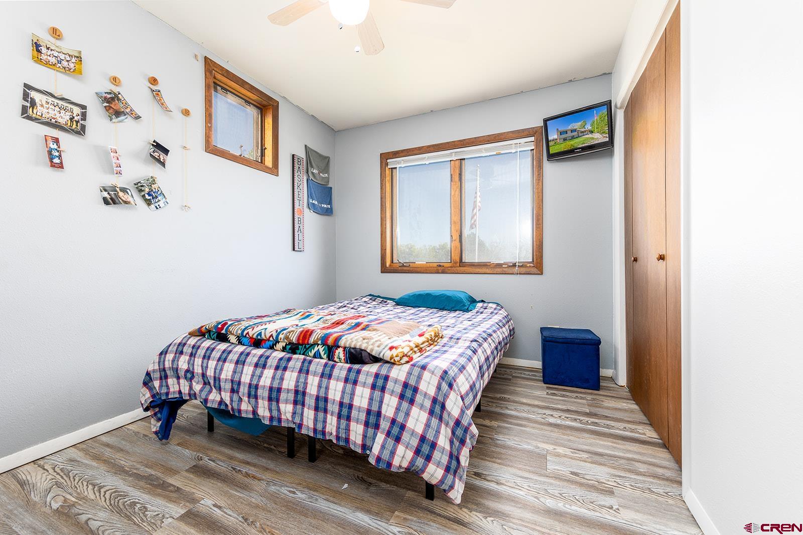 9467 6097 Road Montrose, CO 81401 - Photo 19 of 34 a bedroom with a bed and a window