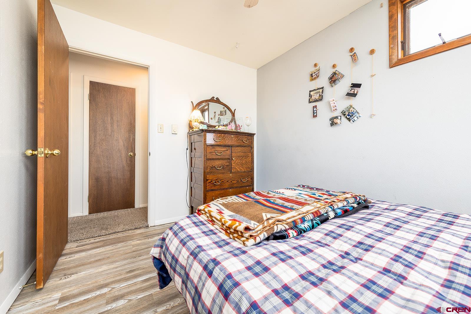 9467 6097 Road Montrose, CO 81401 - Photo 20 of 34 a bedroom with a bed and a window