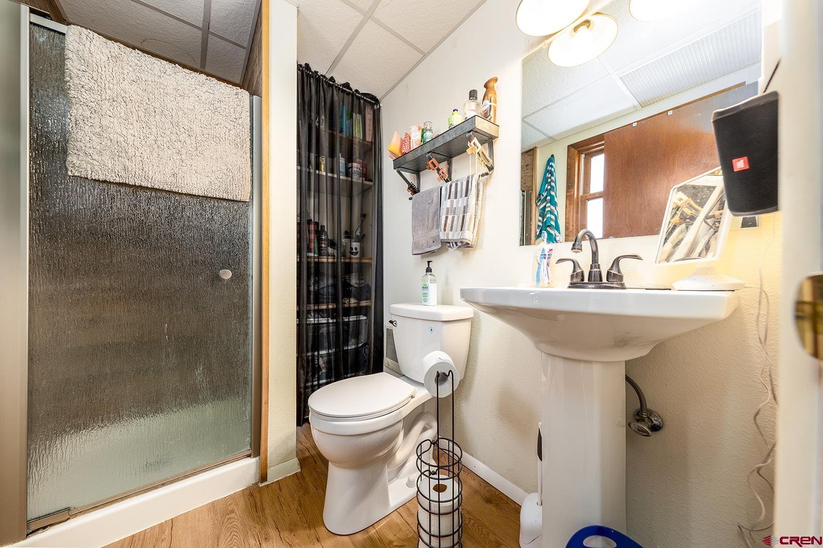 9467 6097 Road Montrose, CO 81401 - Photo 21 of 34 a bathroom with a sink toilet and shower