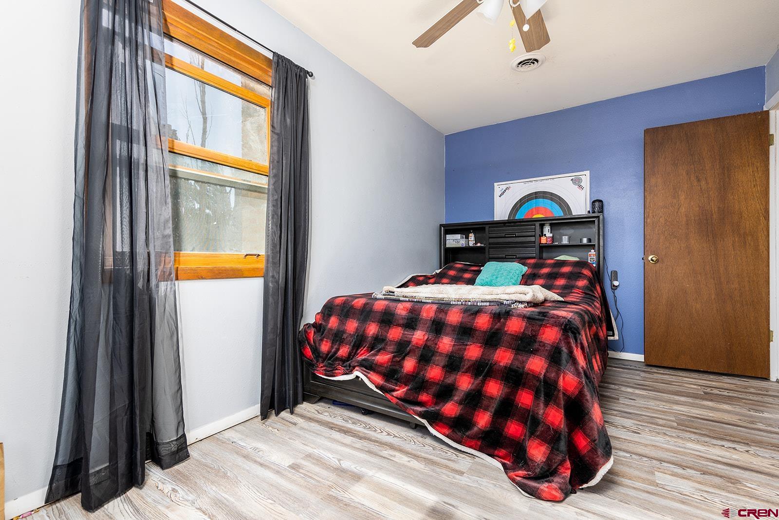 9467 6097 Road Montrose, CO 81401 - Photo 23 of 34 a bedroom with a bed and a window