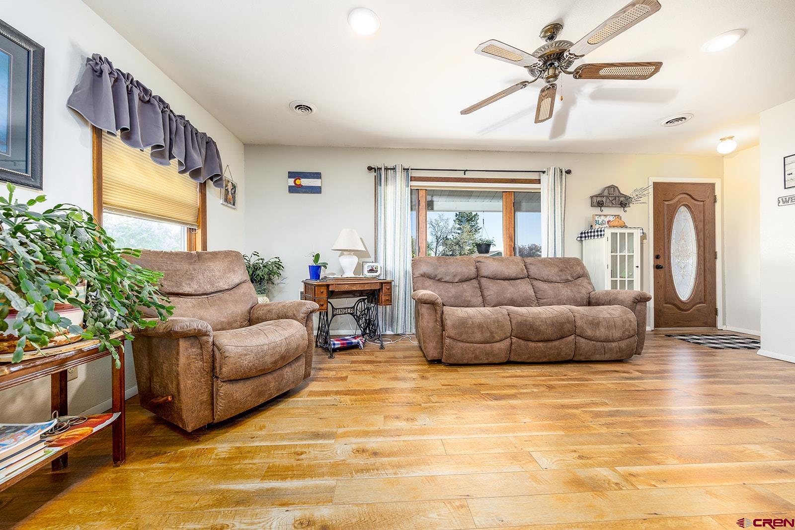 9467 6097 Road Montrose, CO 81401 - Photo 5 of 34 a living room with furniture and a large window