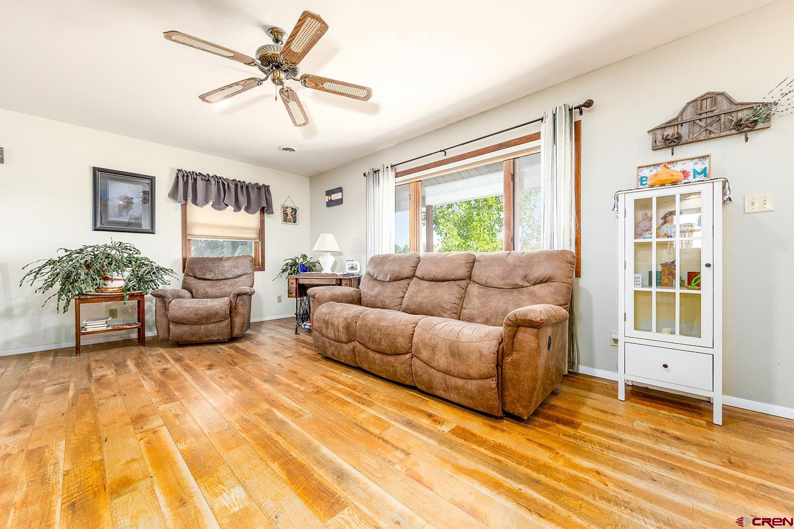 9467 6097 Road Montrose, CO 81401 - Photo 6 of 34 a living room with furniture and a large window