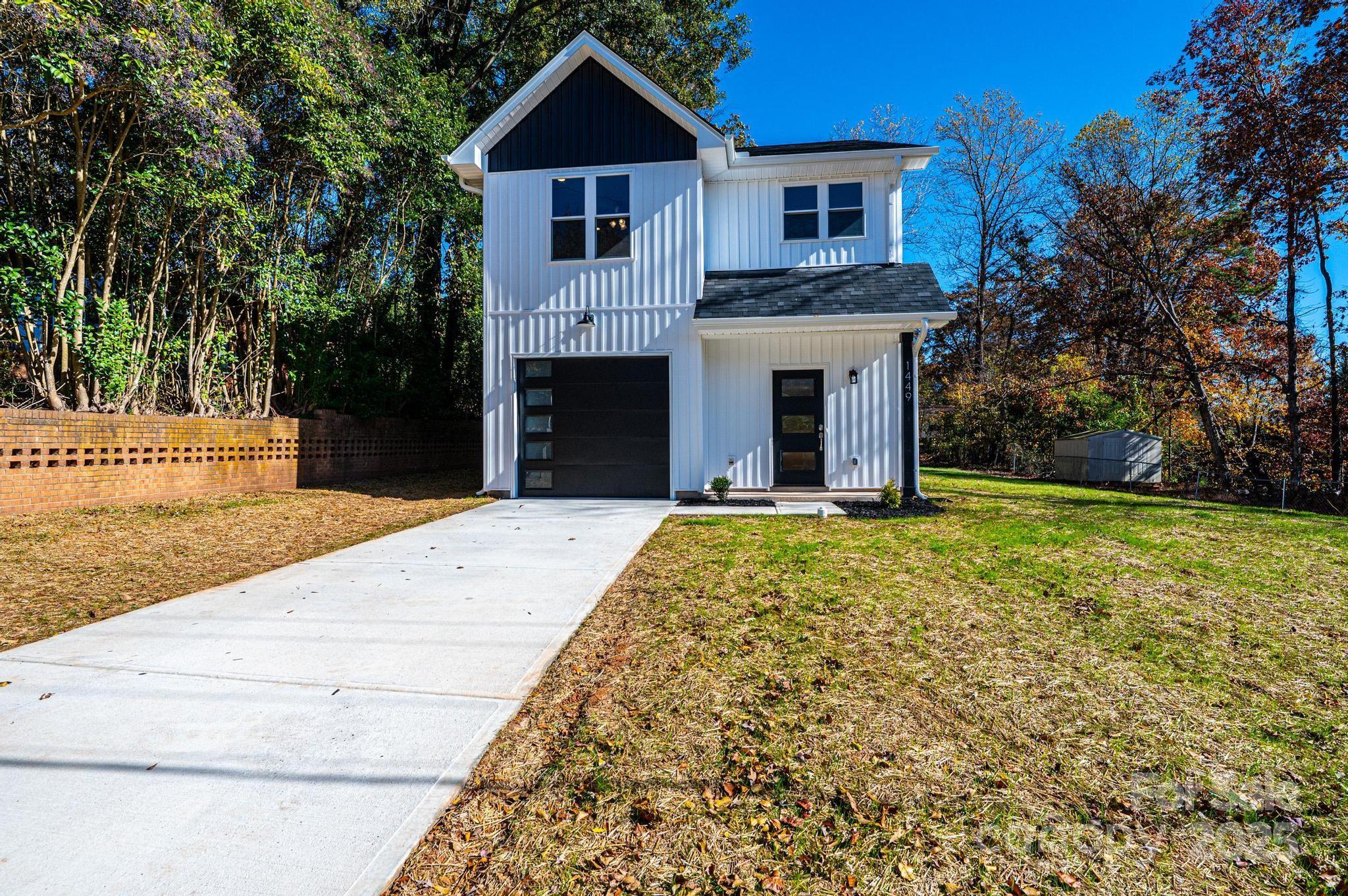 1449 4th Street Southwest Hickory, NC 28602 - Photo 1 of 19 a front view of a house with yard